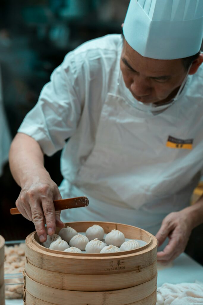 asiatischer Koch Dumplings Dim Sum